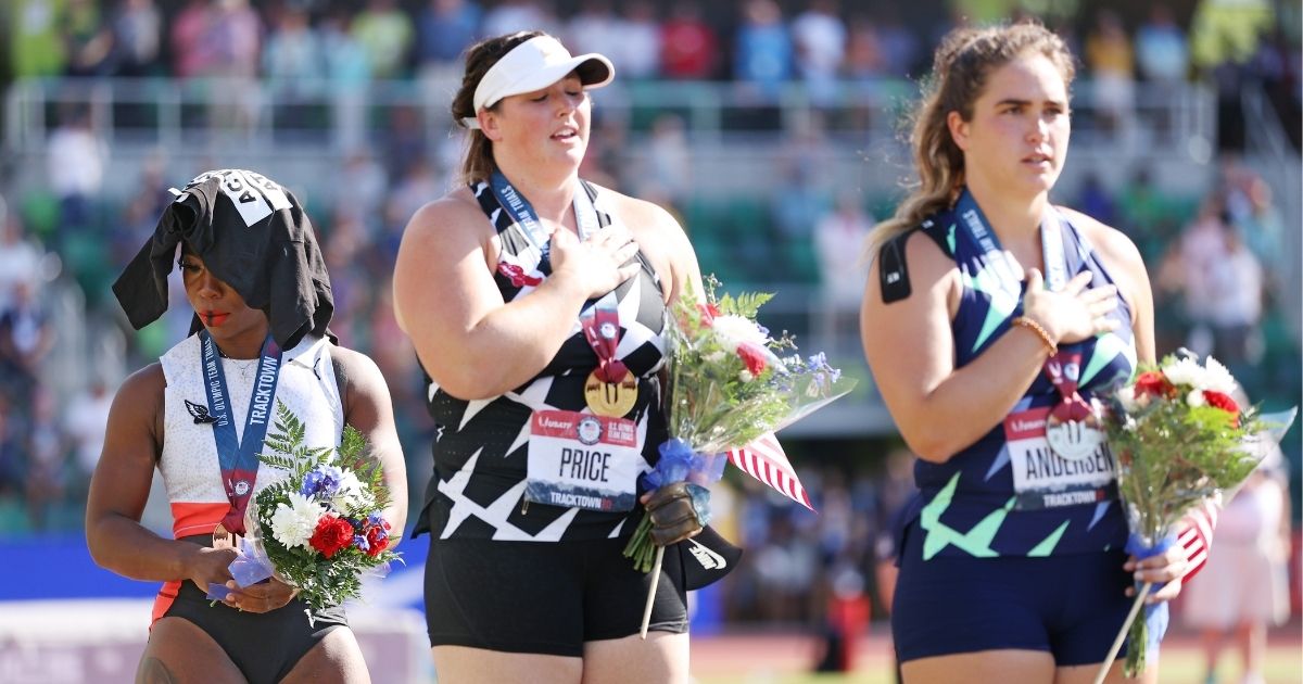 DeAnna Price, center, stands on the first place podium, alongside Gwendolyn Berry (third place), left, and Brooke Andersen (second place), after the Women's Hammer Throw final on day nine of the 2020 U.S. Olympic Track & Field Team Trials at Hayward Field on Saturday in Eugene, Oregon.