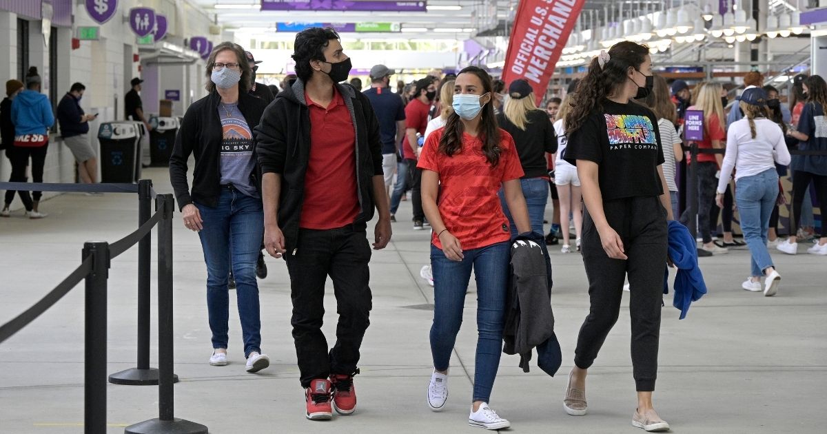 Fans wear face masks as they arrive for a SheBelieves Cup women's soccer match between the United States and Brazil at Exploria Stadium in Orlando, Florida, on Feb. 21.