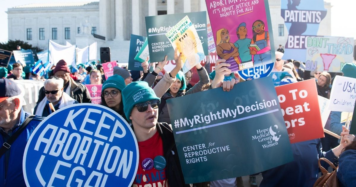 Pro-abortion activists protest during a demonstration outside the US Supreme Court in Washington, D.C., on March 4, 2020.