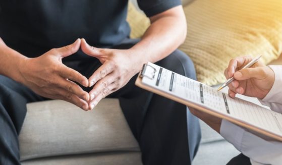 A psychiatrist is pictured meeting with a patient in the stock image above.