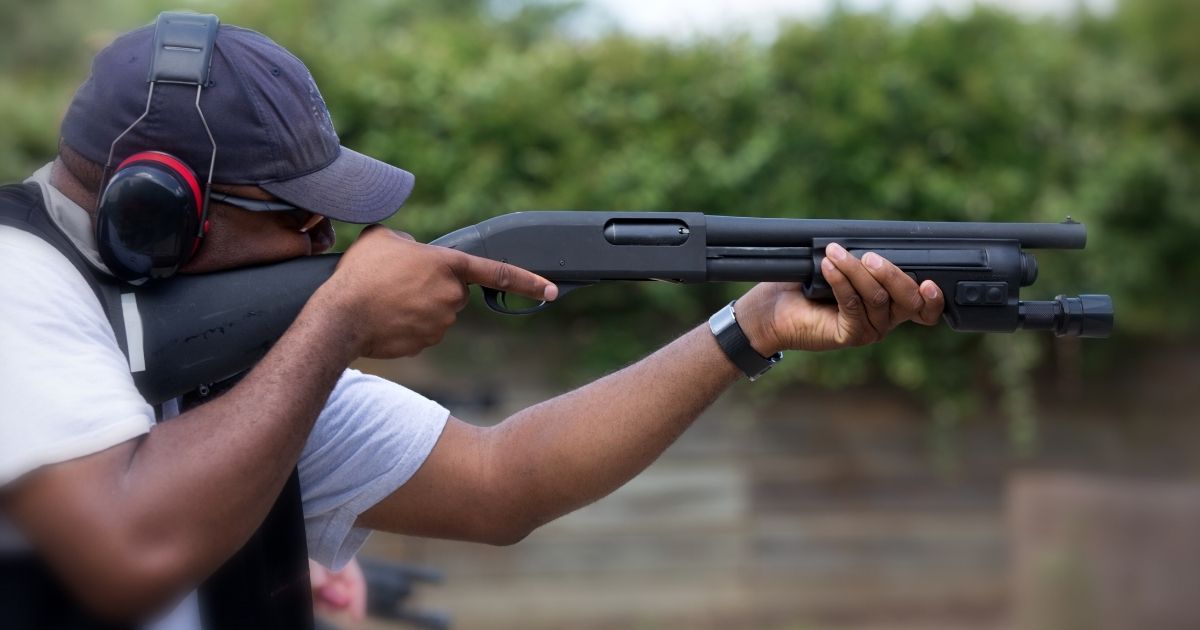 This stock photo portrays an African-American man shooting at a gun range. The American Civil Liberties Union has decided that the Second Amendment perpetuates "anti-blackness" due to its supposedly racist roots.