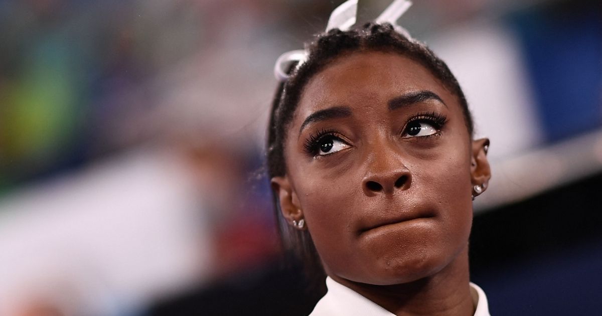 Simone Biles reacts during the artistic gymnastics women's team final of the Tokyo 2020 Olympic Games at the Ariake Gymnastics Centre on Tuesday.