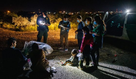 Migrants are accounted for and processed by Border Patrol officers after crossing the Rio Grande into the United States on July 1, 2021, in Roma, Texas.