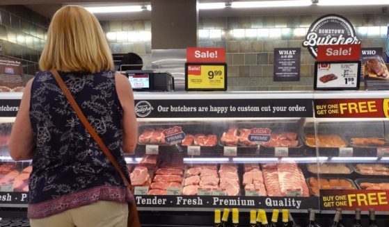 A customer shops for meat at a supermarket on June 10, 2021 in Chicago, Illinois.
