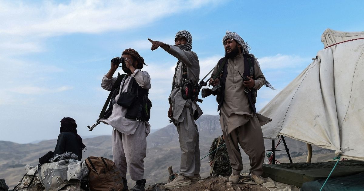 Afghan militia fighters keep watch against Taliban insurgents at an outpost in Balkh province, Afghanistan, on July 15, 2021.