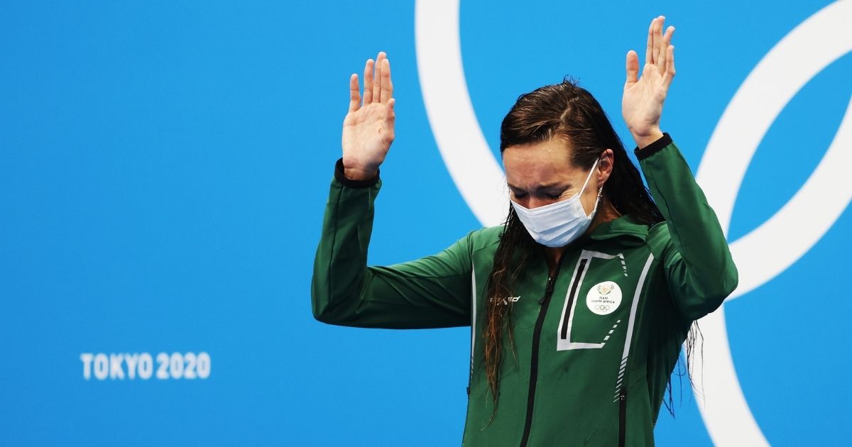 Tatjana Schoenmaker of South Africa is seen on the podium after winning gold and breaking the world record in the women's 200-meter breaststroke at the Tokyo Olympic Games on Friday in Tokyo.