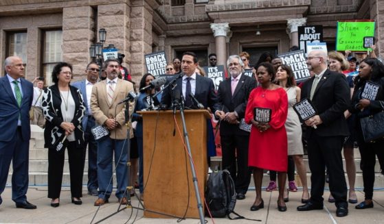 Democratic Texas state Rep. Trey Martinez Fischer speaks alongside members of the Texas House Democratic Caucus and progressive activists during a rally outside of the Texas State Capitol on Thursday in Austin, Texas.