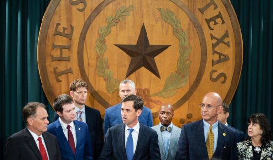 Republican Texas Rep. Mayes Middleton (C) of the Texas Freedom Caucus addresses the media with other Texas House Republicans in the Texas Capitol on Tuesday in Austin, Texas.