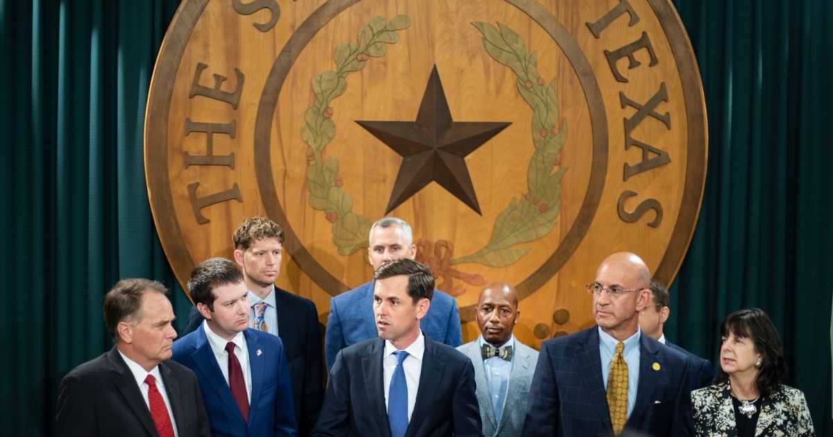 Republican Texas Rep. Mayes Middleton (C) of the Texas Freedom Caucus addresses the media with other Texas House Republicans in the Texas Capitol on Tuesday in Austin, Texas.