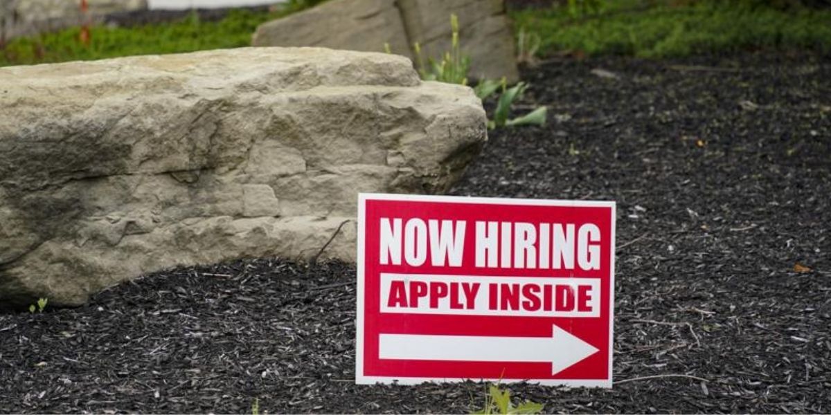 Hiring signs are posted outside a gas station in Cranberry Township, Pennsylvania, on May 5, 2021.