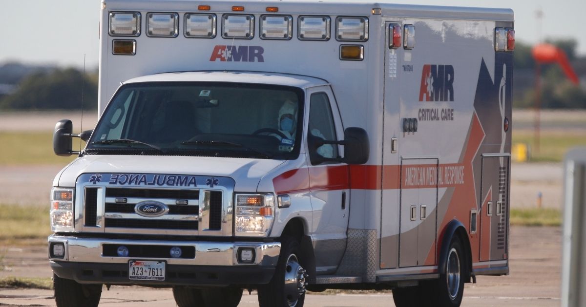An ambulance is seen driving on the tarmac at the Love Health Field Airport in Dallas on Oct. 15, 2014.