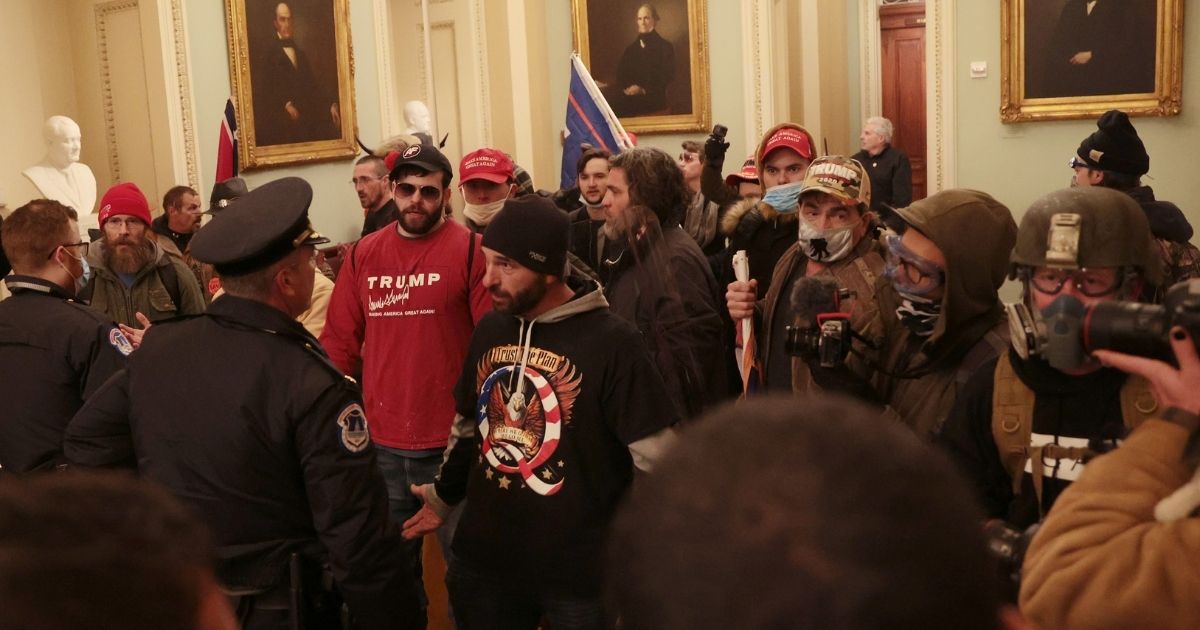 Protesters and Capitol Police square off inside the Capitol during the Jan. 6 incursion that left protester Ashli Babbitt shot dead. Authorities have