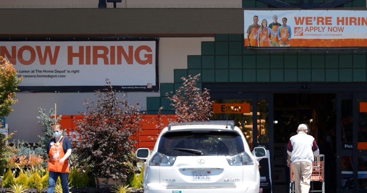 "Now Hiring" signs posted in front of a Home Depot store last week in San Rafael, California.