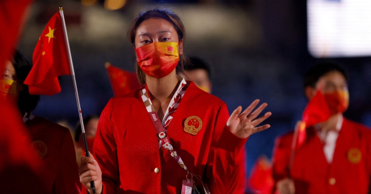 A member of China's delegation parades during the opening ceremony of the Tokyo 2020 Olympic Games, at the Olympic Stadium, in Tokyo on Friday.