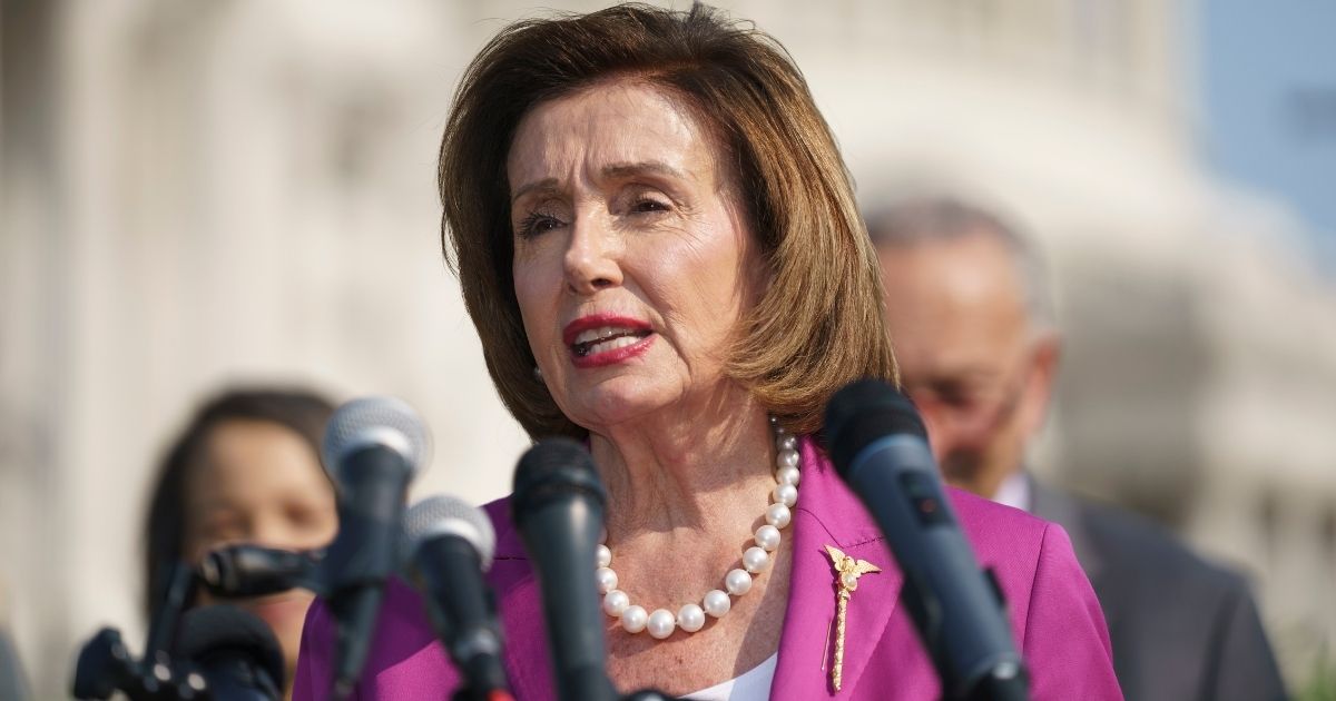 House Speaker Nancy Pelosi addresses an outdoor event Wednesday in Washington.
