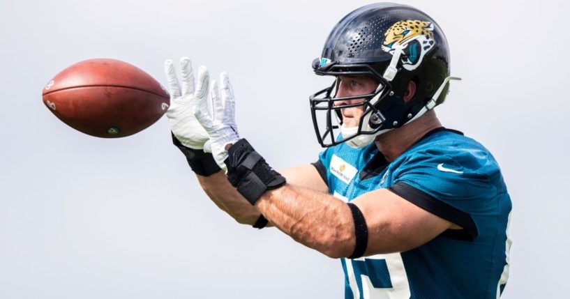 Tim Tebow of the Jacksonville Jaguars prepares to catch a pass during training camp in Jacksonville, Florida, on July 30, 2021.