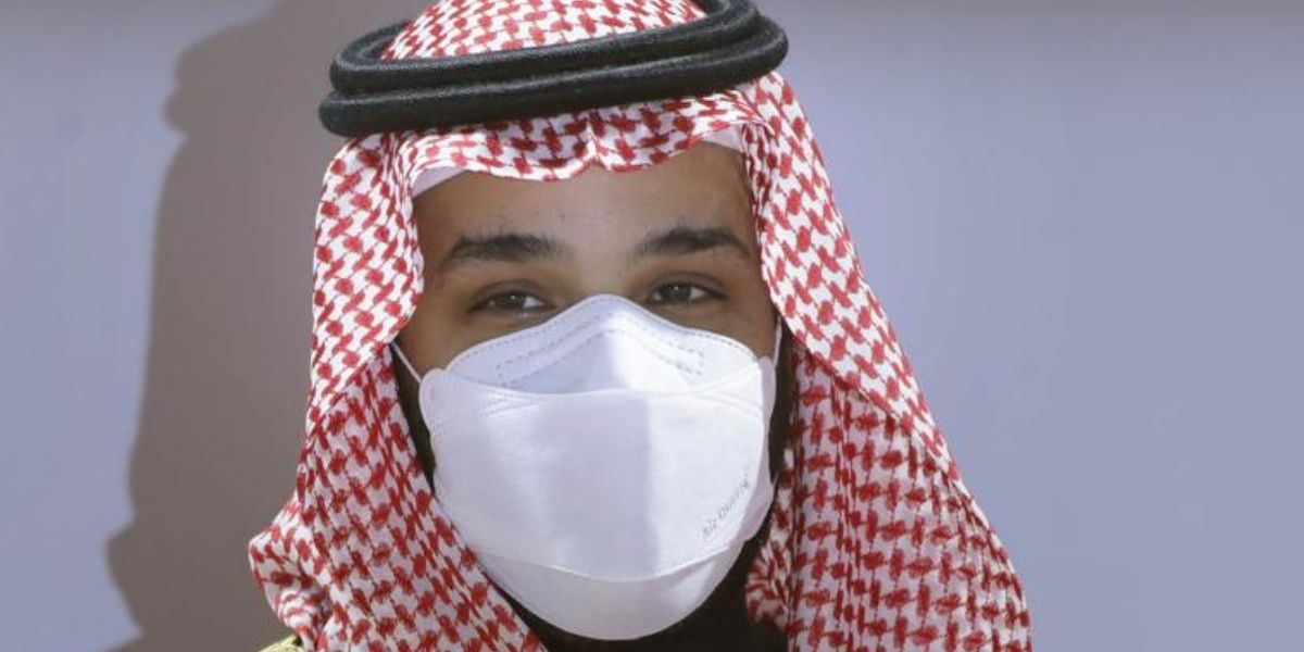 Saudi Crown Prince Mohammed bin Salman wears a face mask as he attends the Saudi Cup award ceremony during the final race of the $20 million, the Saudi Cup, at King Abdul Aziz race track in Riyadh, Saudi Arabia, on Feb. 20, 2021.