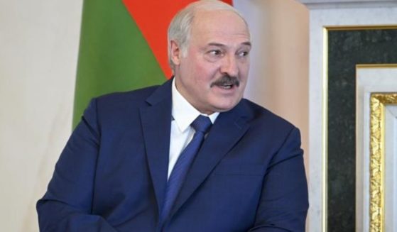 Belarusian President Alexander Lukashenko listens to Russian President Vladimir Putin during their meeting in St. Petersburg, Russia, on Tuesday.