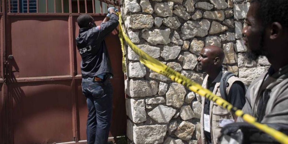 A security official cordons off access to the residence of late Haitian President Jovenel Moïse in Port-au-Prince, Haiti, on Wednesday.