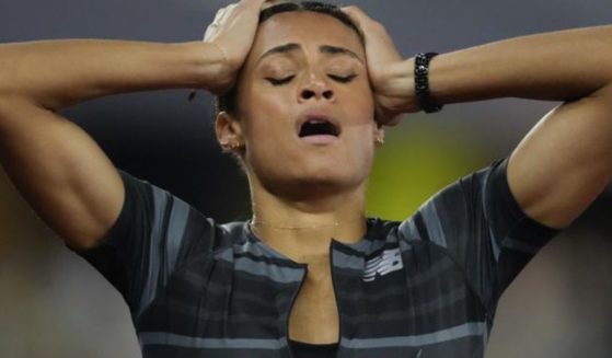 Sydney McLaughlin reacts after setting the world record in the finals of the women's 400-meter hurdles at the U.S. Olympic Track and Field Trials in Eugene, Oregon, on June 27.