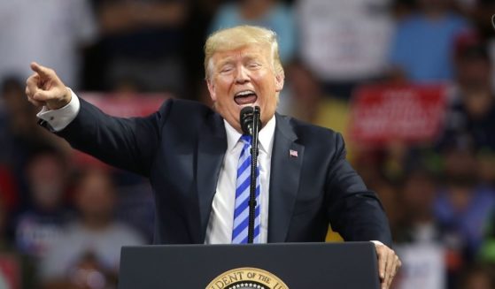 Then-President Donald Trump speaks during a rally at the Charleston Civic Center in Charleston, West Virginia, on Aug. 21, 2018.