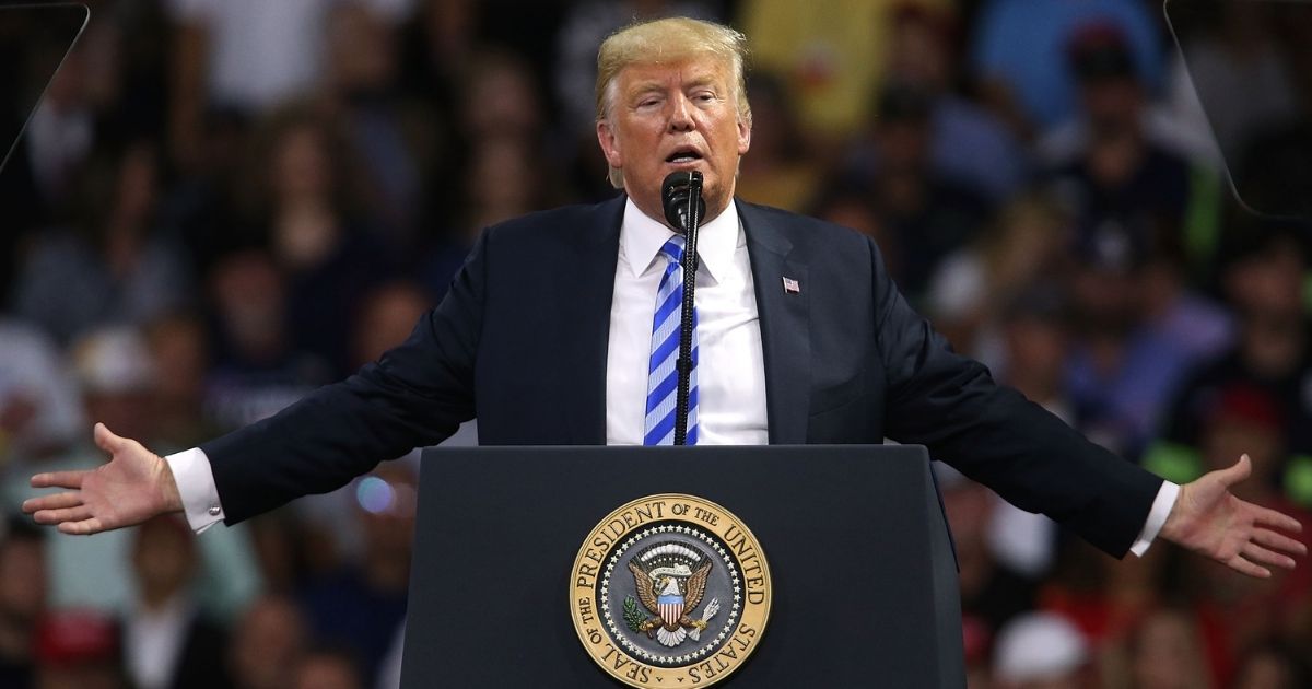 Then-President Donald Trump speaks at a rally on Aug. 21, 2018, in Charleston, West Virginia.