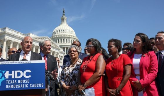 Joined by fellow Texas state House Democrats, Rep. Chris Turner speaks during a news conference on voting rights outside the U.S. Capitol on July 13, in Washington, D.C.