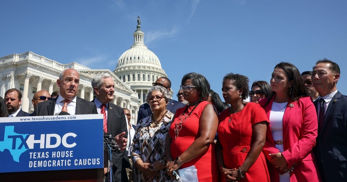 Joined by fellow Texas state House Democrats, Rep. Chris Turner speaks during a news conference on voting rights outside the U.S. Capitol on July 13, in Washington, D.C.