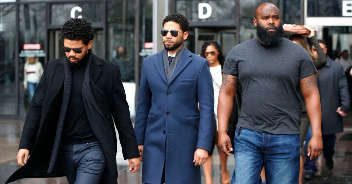 Actor Jussie Smollett, center, leaves Leighton Criminal Courthouse after his court appearance on March 14, 2019, in Chicago.