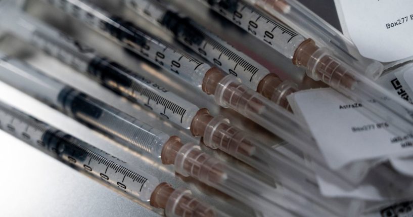 Syringes containing the AstraZeneca coronavirus vaccine sit on a metal tray before being administered to people at Central Vaccination Center in Bang Sue Grand Station on Tuesday in Bangkok.