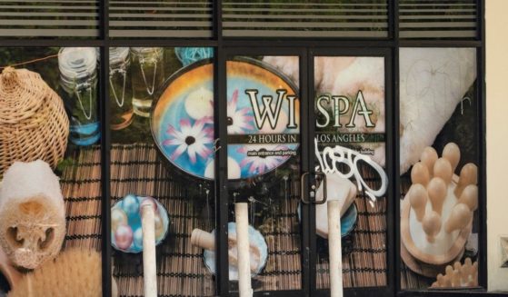 A vandalized window is seen at the Wi Spa in the Koreatown district of Los Angeles on July 4, 2021.