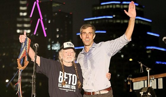Former Texas Rep. Beto O'Rourke joins country music legend Willie Nelson on stage during a concert in support of O'Rourke's campaign for U.S. Senate at Auditorium Shores in Austin on Sept. 29, 2018.