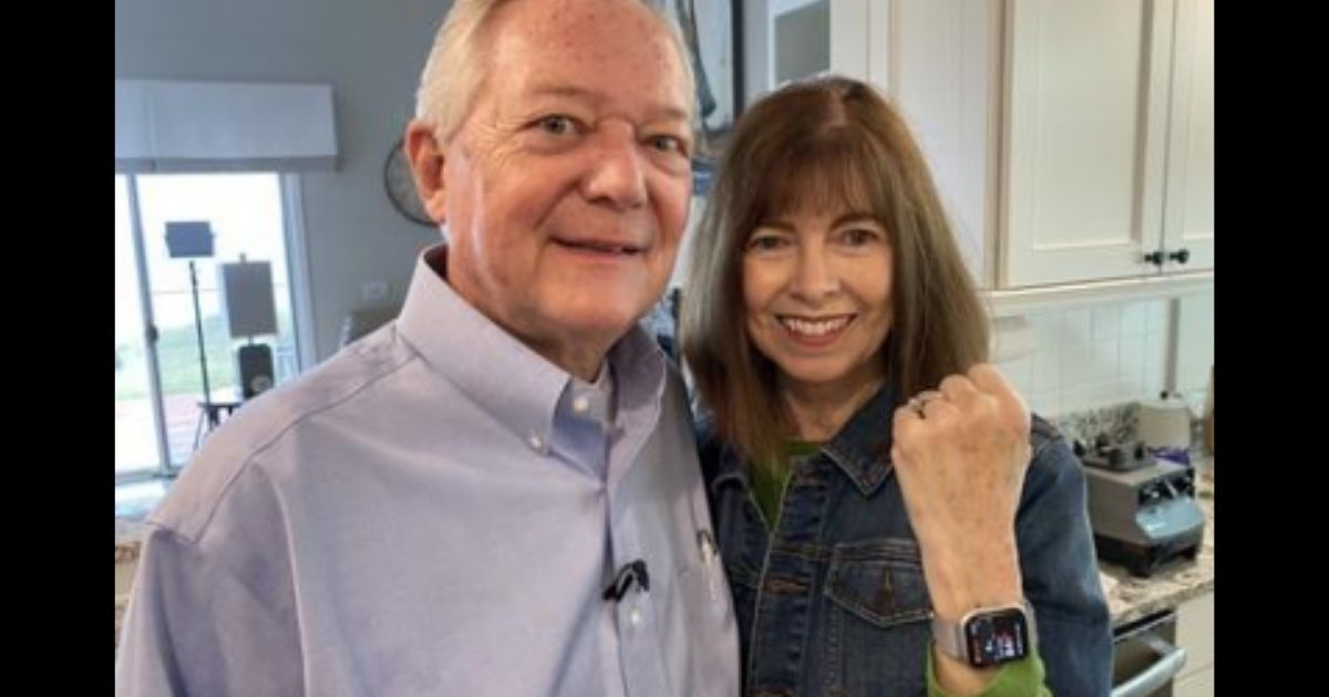 Diane Feenstra with her husband Gary and her Apple watch