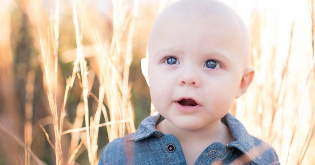 Asher was diagnosed with cancer at age 4 months after his mom, Josie Rock, noticed something odd in a photo she took of him.