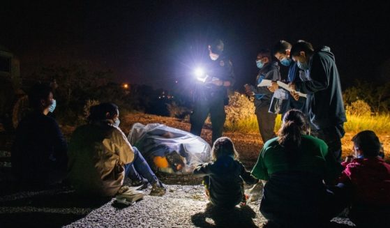 Migrants are accounted for and processed by U.S. Border Patrol after crossing the Rio Grande into the United States on Thursday in Roma, Texas.