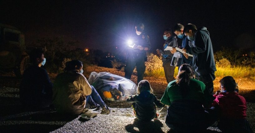 Migrants are accounted for and processed by U.S. Border Patrol after crossing the Rio Grande into the United States on Thursday in Roma, Texas.
