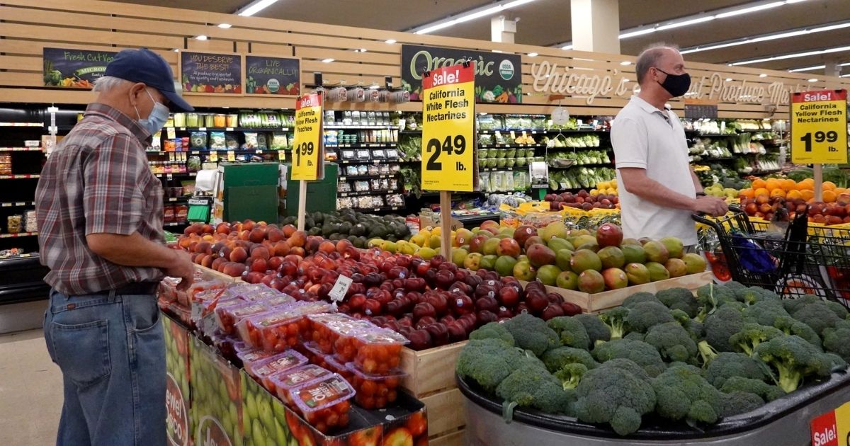 Customers shop for produce at a supermarket on June 10, 2021, in Chicago.