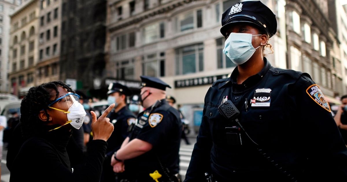A protester shouts at a New York Police Department officer during a Black Lives Matter demonstration on May 28, 2020, in New York City.