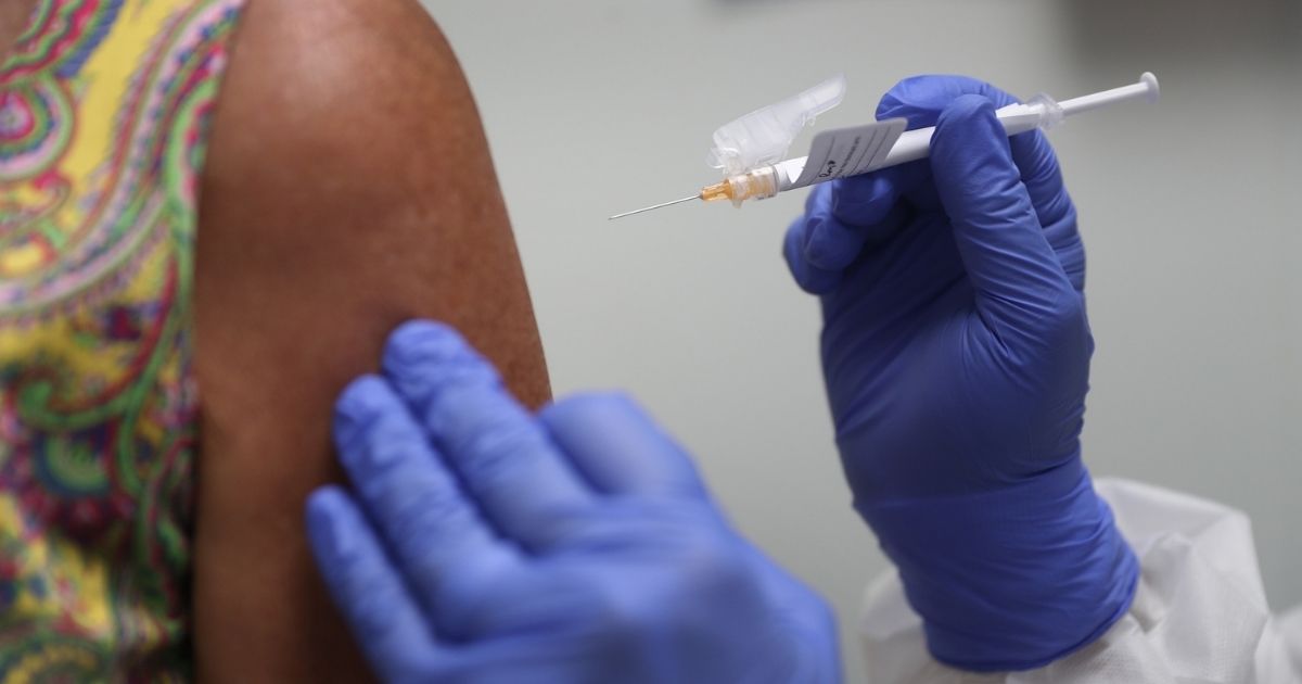 A woman receives a COVID-19 vaccination on Aug. 7, 2020, in Hollywood, Florida.