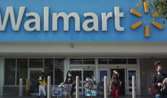 People walk out of a Walmart store in Hallandale Beach, Florida, on May 18.
