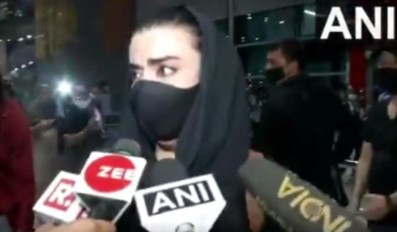 An Afghan woman gives an interview upon arriving in Delhi after fleeing Kabul on Sunday.