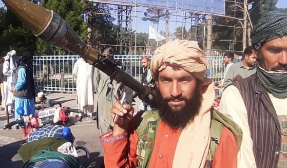 A Taliban fighter holds a rocket-propelled grenade in Herat, Afghanistan, on Friday.