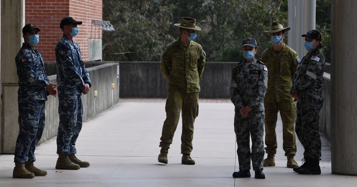 Members of the Australian Defence Force from the Air Force, Army and Navy, all of whom will serve as support to the NSW Police Service, attend a media conference at Sydney Police Centre in Sydney on Monday.