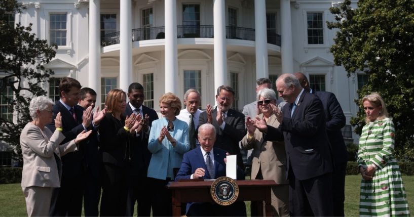 Auto industry executives and representatives applaud after President Joe Biden signs an executive order on electric vehicles on the South Lawn of the White House in Washington on Aug. 5.