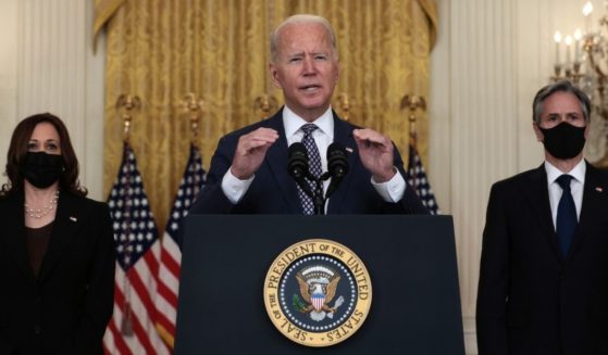 President Joe Biden delivers remarks on the U.S. military’s ongoing evacuation efforts in Afghanistan, while flanked by Vice President Kamala Harris, left, and Secretary of State Antony Blinken, right, in the East Room of the White House on Friday in Washington, D.C.