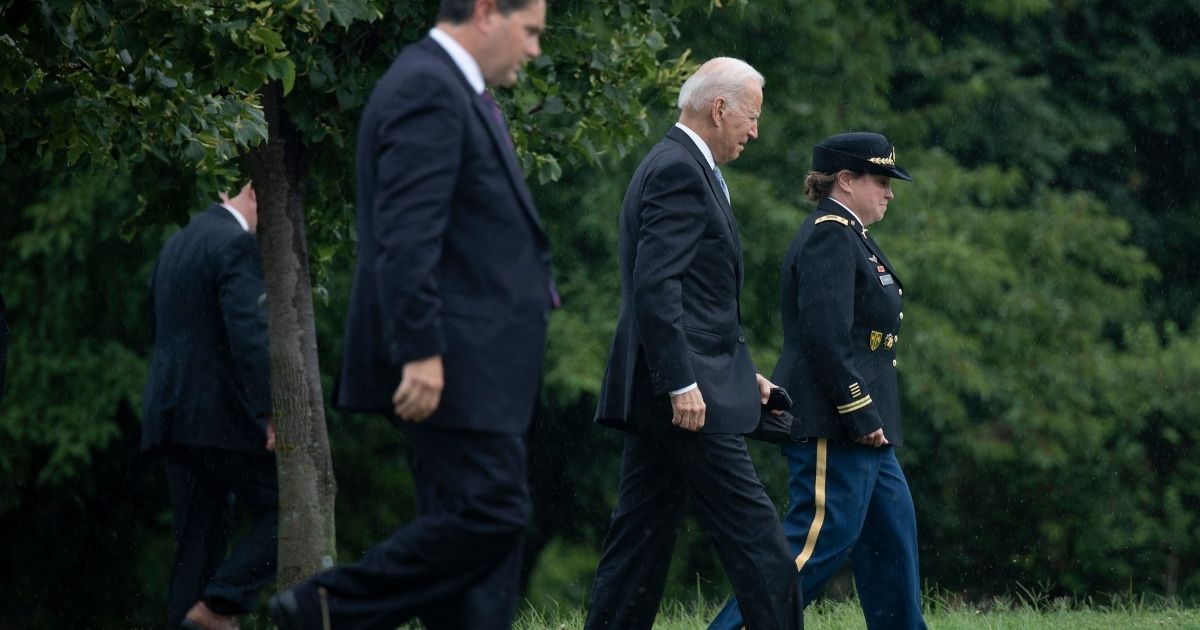 President Joe Biden walks to Marine One at Fort McNair after briefly returning to the White House to address the nation about the Taliban takeover of Afghanistan on Monday.