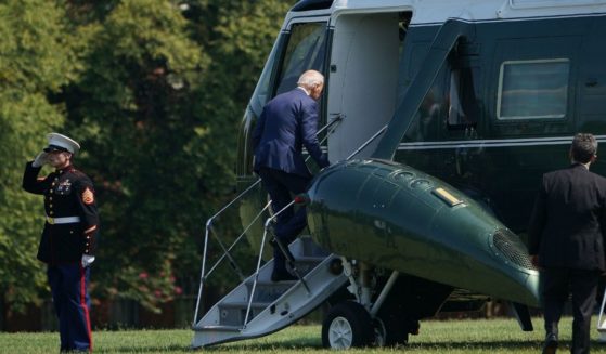 President Joe Biden boards Marine One before departing from Fort McNair in Washington on Thursday.