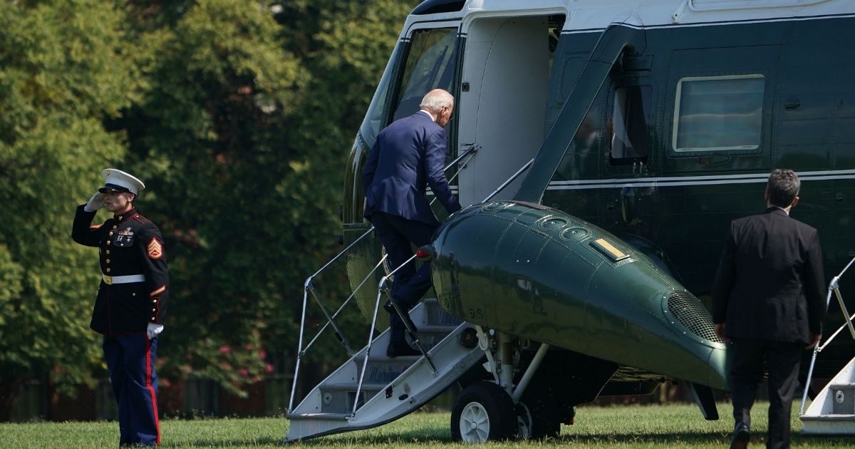 President Joe Biden boards Marine One before departing from Fort McNair in Washington on Thursday.