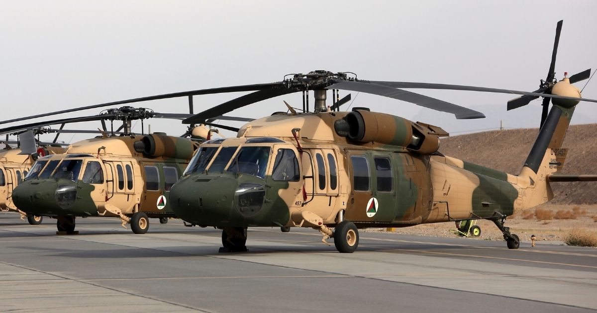 In this 2018 photo, UH-60 Black Hawk helicopters are parked at Kandahar Air Field in Afghanistan.