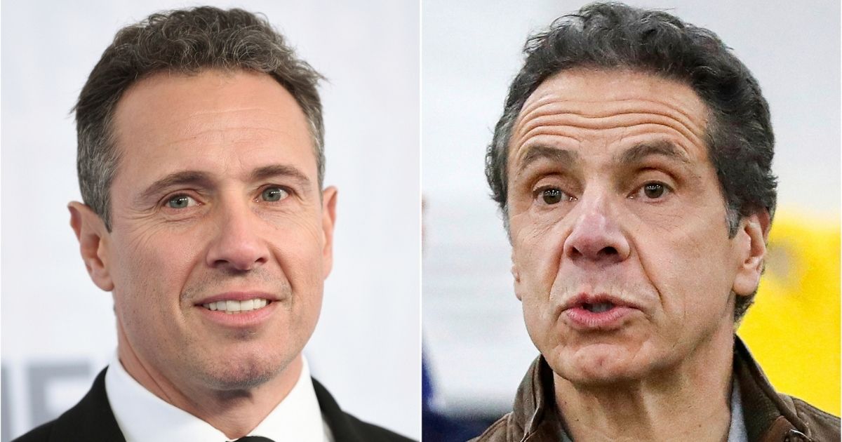 This combination photo shows CNN news anchor Chris Cuomo, left, at the WarnerMedia Upfront in New York on May 15, 2019, and Democratic New York Gov. Andrew Cuomo speaking during a news conference in New York on March 23, 2020.
